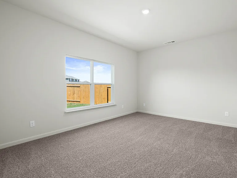 The family room is spacious and has large windows.