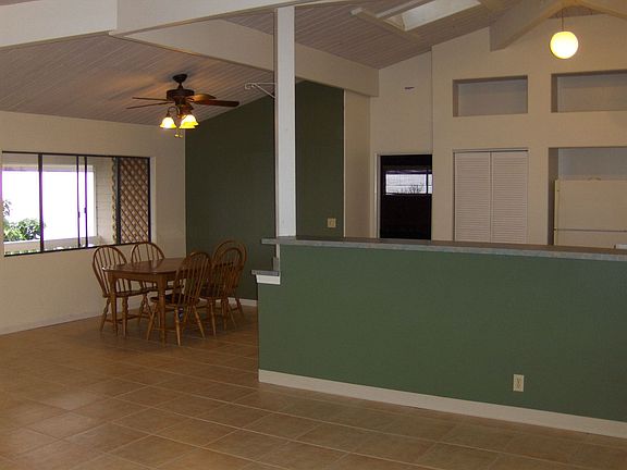 The dining area to the left of the kitchen has a fine view through the window.