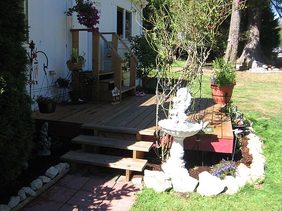 Beautiful landscaping and plenty of room to garden
