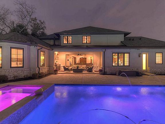 First pool is heated & boasts multi-colored lighting, iridescent waterfalls, & spa. Twenty-five yard lap pool (heated/chilled) and also offers gorgeous waterfalls! Additional outdoor features include mosquito misting system, full gutters & sprinklers