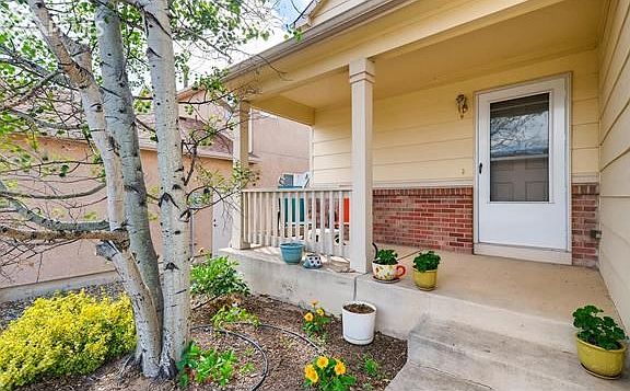 The front porch is waiting for you to relax on