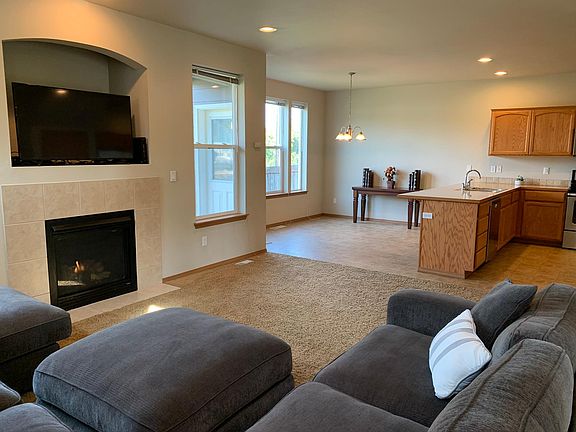 Living room opens into the kitchen and dining rooms, great for entertaining!