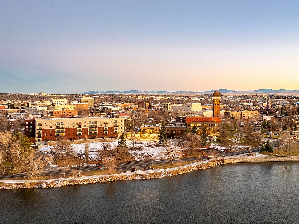 Experience the charm of riverside living with stunning sunset views.