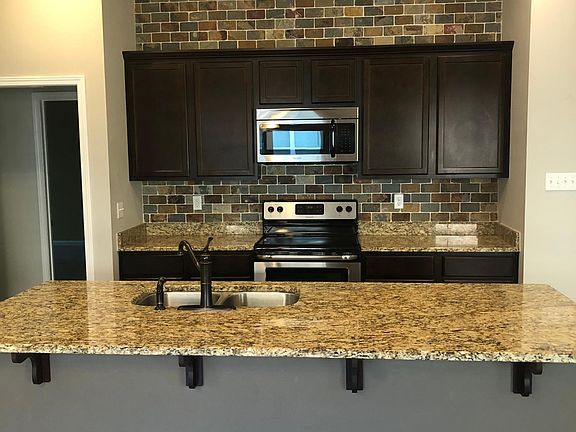 Beautiful granite countertops with custom backsplash