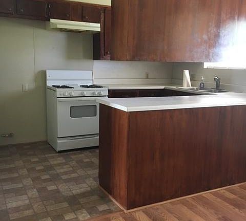 Kithchen with propane stove and refinished cabinets