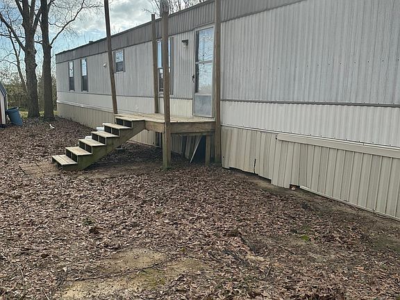 will add covered porch. This mobile home is nested alone in a country setting with a peaceful view