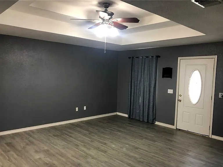 Living room, 16' x 18', with coffered ceiling & vinyl plank flooring