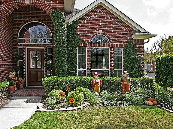 A Warm, Charming, & Well Maintained Family Home With a Mostly Brick Exterior & Tinted East/West Windows