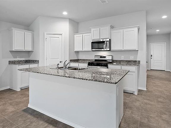 Kitchen - All Home and community information, including pricing, included features, terms, availability and amenities, are subject to change at any time without notice or obligation. All Drawings, pictures, photographs, video, square footages, floor plans, elevations, features, colors and sizes are approximate for illustration purposes only and will vary from the homes as built.