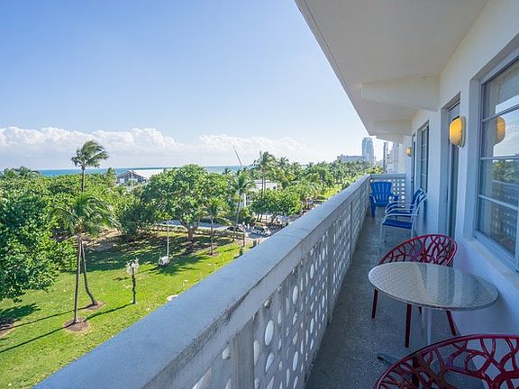 Expansive Balcony Overlooks Park and Beach
