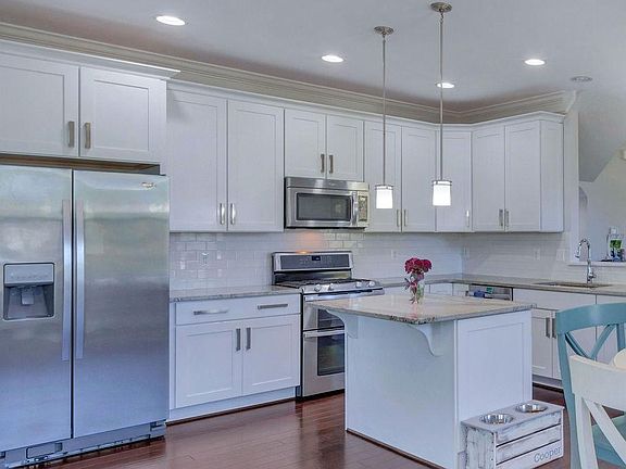 Kitchen w soft close maple cabinets. Double oven