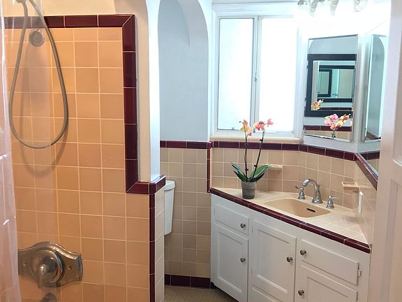 Tile bath with recessed lighting, fan & heater.