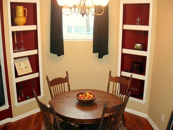 Dining room w/built-ins and custom paint.