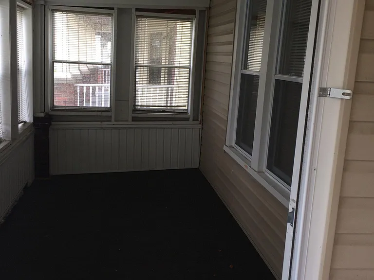 ENCLOSED FRONT PORCH