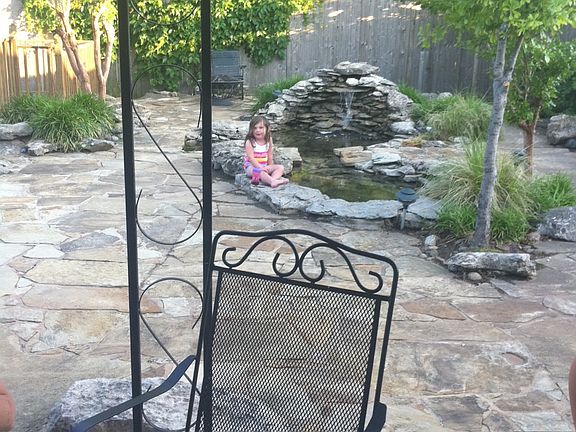 covered patio with KOI pond