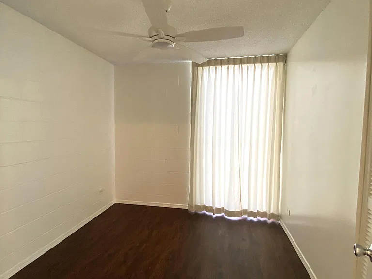 2nd Bedroom w/ drapes and quiet ceiling fan light