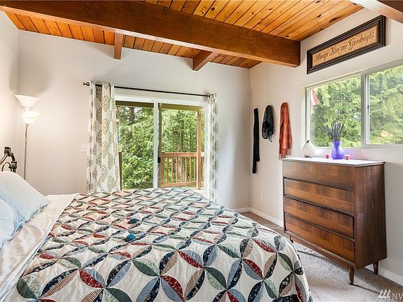 The master has great access to the lower back porch and you have to love those ceilings! :)