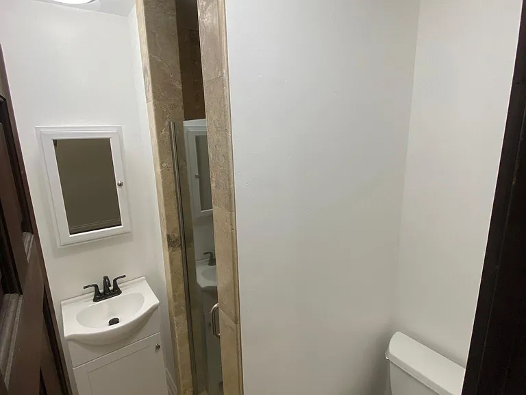 Middle bathroom with standup shower