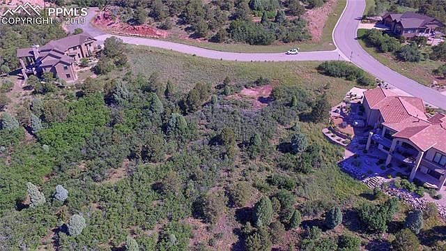 The 1.88 acre lot is tucked between two large parcels with custom-built homes and borders Solitude Park on the lower side - look for Lot 8 in the Placer Park Ridge plat map (attached)