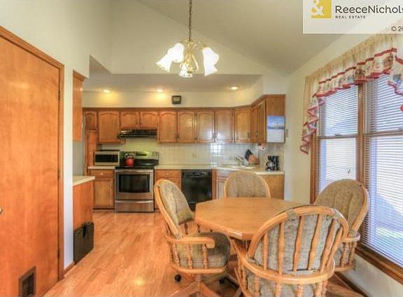 Eat in kitchen features laminate and window overlooks the backya