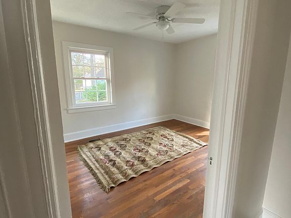 Bedroom 1 (140 sq. ft.) ceiling fan, 2 windows