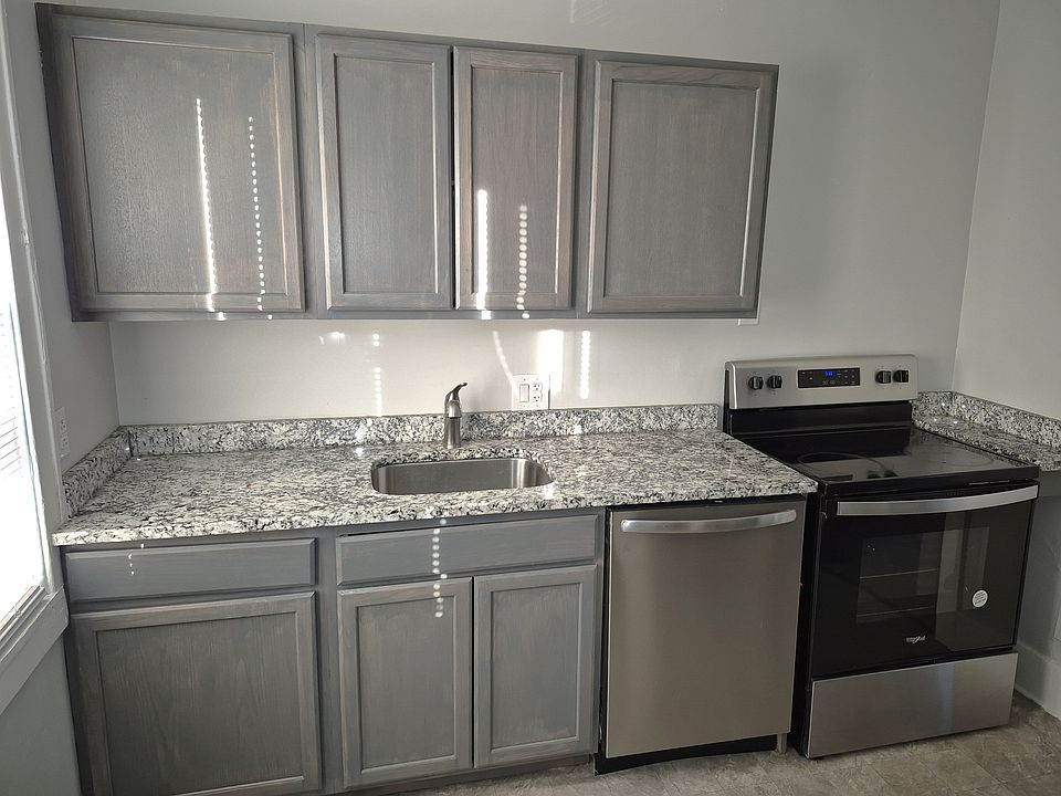 Remodeled kitchen w/ granite countertops.