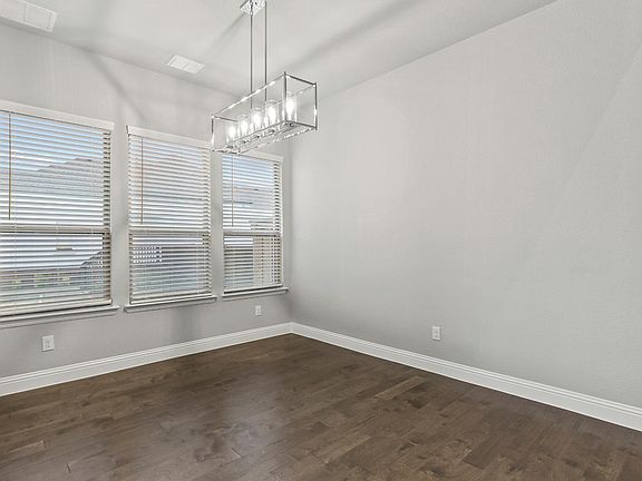 Dining room in the Waldorf II home plan by Trophy Signature Homes - REPRESENTATIVE PHOTO