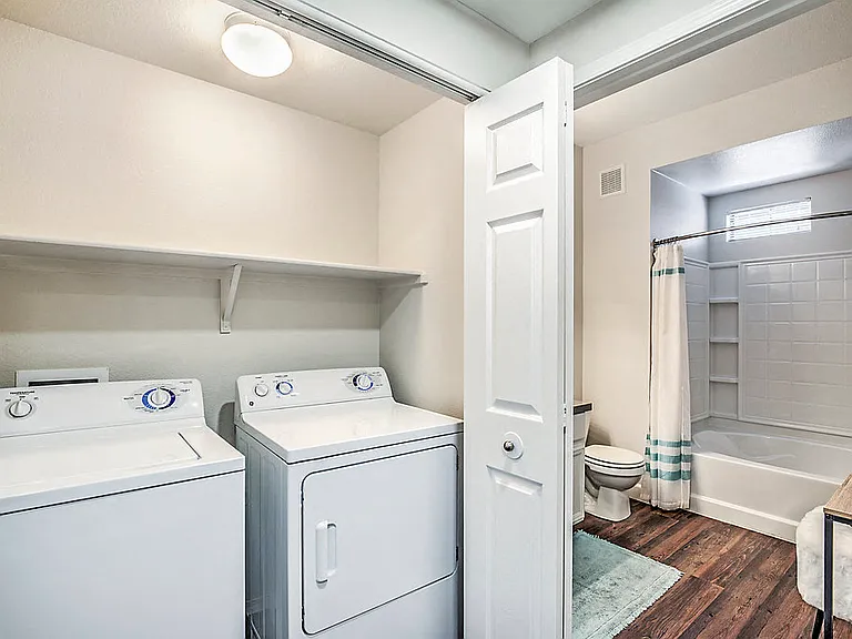 Enjoy the convenience of in-unit laundry at The Michael B - where every load is a breeze, and spaciousness meets modern living.