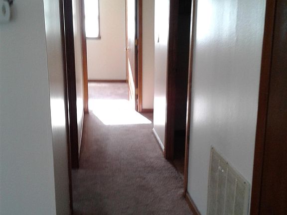 Hallway leading to 3 bedrooms and 1 bath.
