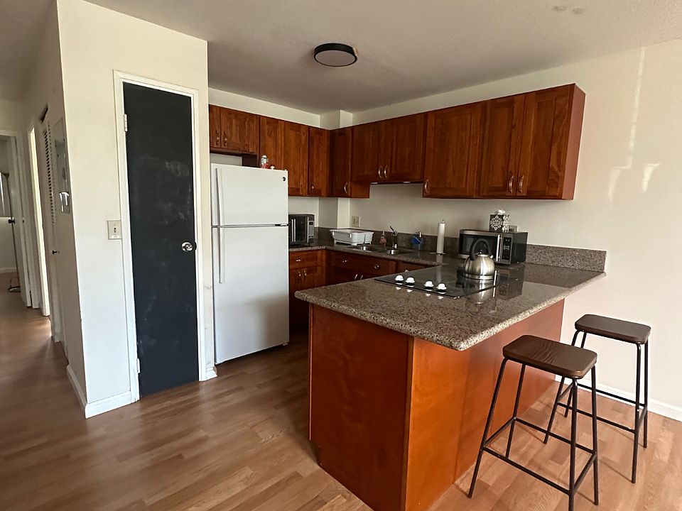 Kitchen (including microwave, airfryer, refrigerator) with pantry.