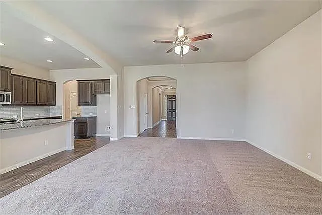 LIVING ROOM UPGRADED FROM CARPET TO TILE