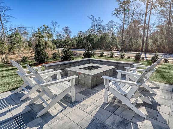 The outdoor patio beckons with welcoming allure, offering a serene escape.