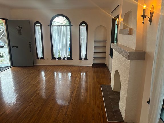 Oversized living room with mock fireplace