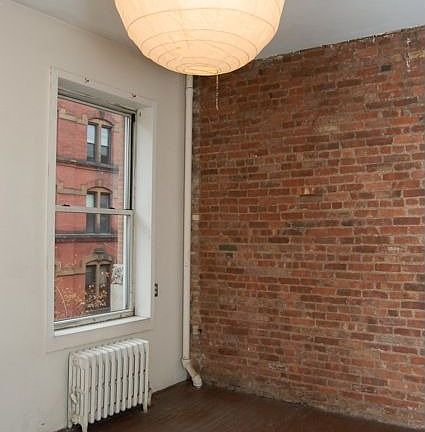 Exposed Brick Bedroom Wall