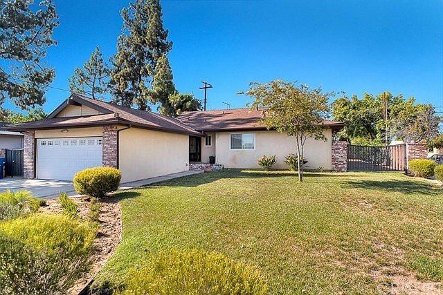 Situated in a desirable Northridge neighborhood this home boasts handsome curb appeal with mature la
