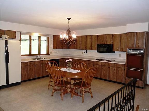 Large kitchen is open to family room & has new dishwasher.
