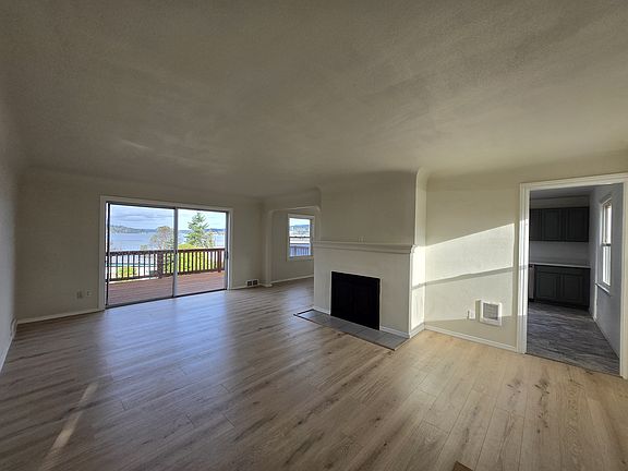 Wood burning fireplace. So much sunlight. Lots of double paned windows throughout.