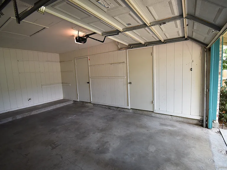 Shared garage where you can park one car. The door to the right leads to your private laundry room