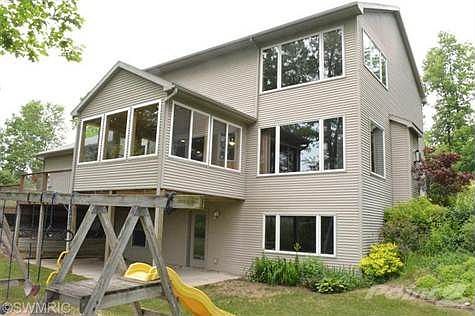 Large Low-E Pella windows with a view of all nature.