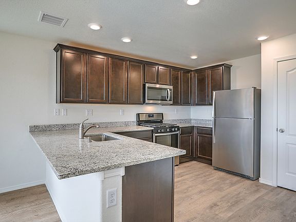 Stunning kitchen with stainless appliances.