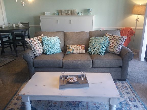 TWIN MURPHY BED BEHIND SOFA