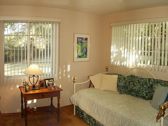 Bedroom #2 with view to back yard and own entrance