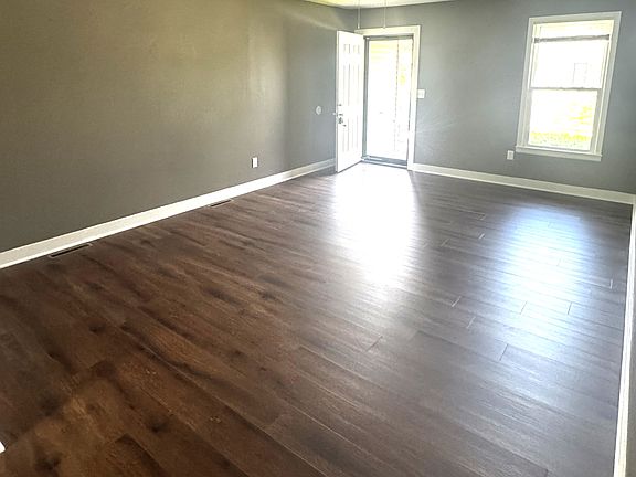 FROM DINING AREA LOOKING AT LIVING ROOM