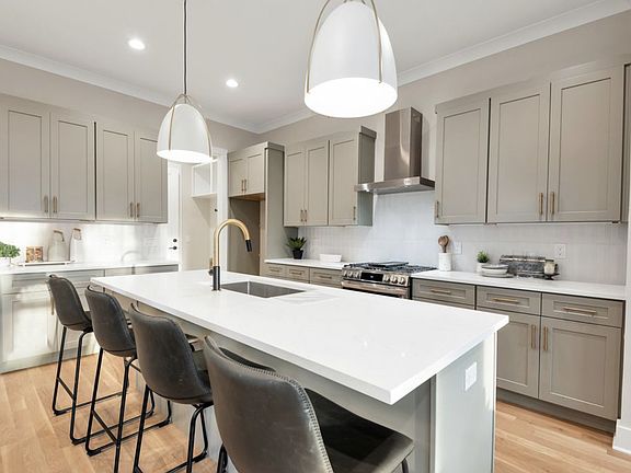 Kitchen with large island and gas stove