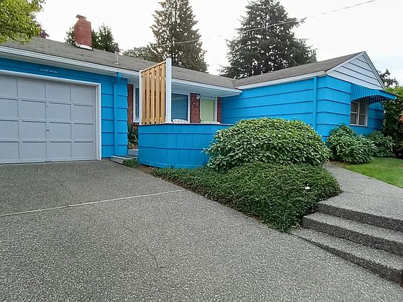 House and Attached Garage from Concrete Driveway