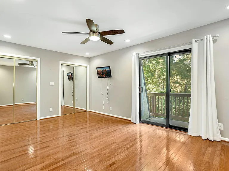 Master Bedroom with TV, 2 closets and outdoor patio.