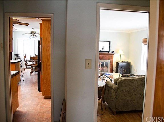 HALLWAY LOOKING INTO LIVING ROOM AND KITCHEN