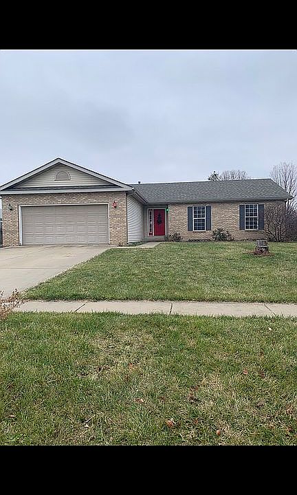 Front view with 2 car garage