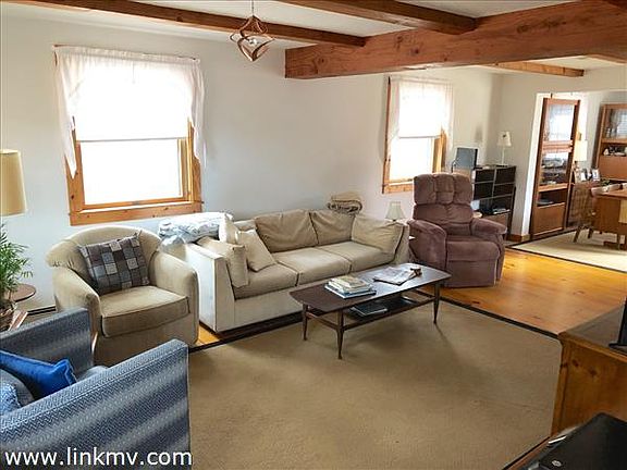 Warm and cozy living room with beams.