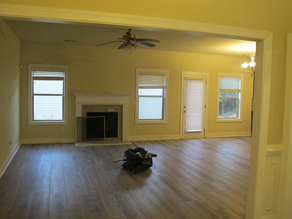 family room, door to the back yard, kitchen is on the right side